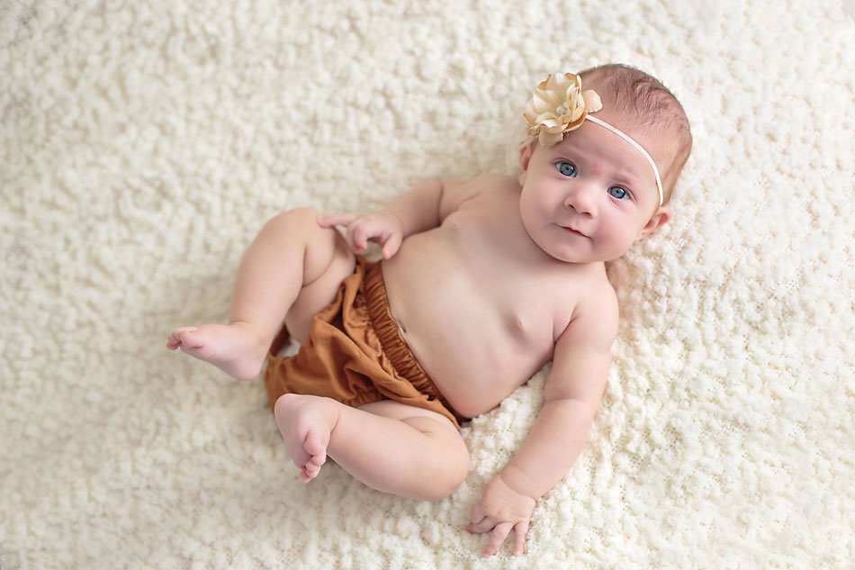 Three month old baby girl wearing Carhartt diaper cover. Photo by Pueblo baby photographer K.D. Elise Photography.