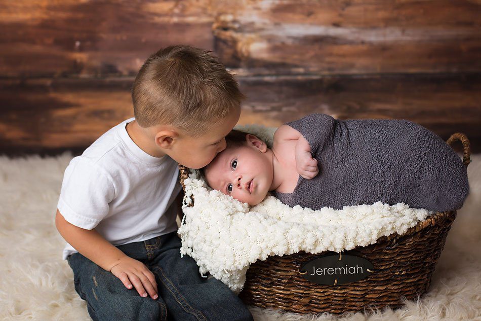 Newborn baby boy with his big brother by Pueblo newborn photographer K.D. Elise Photography