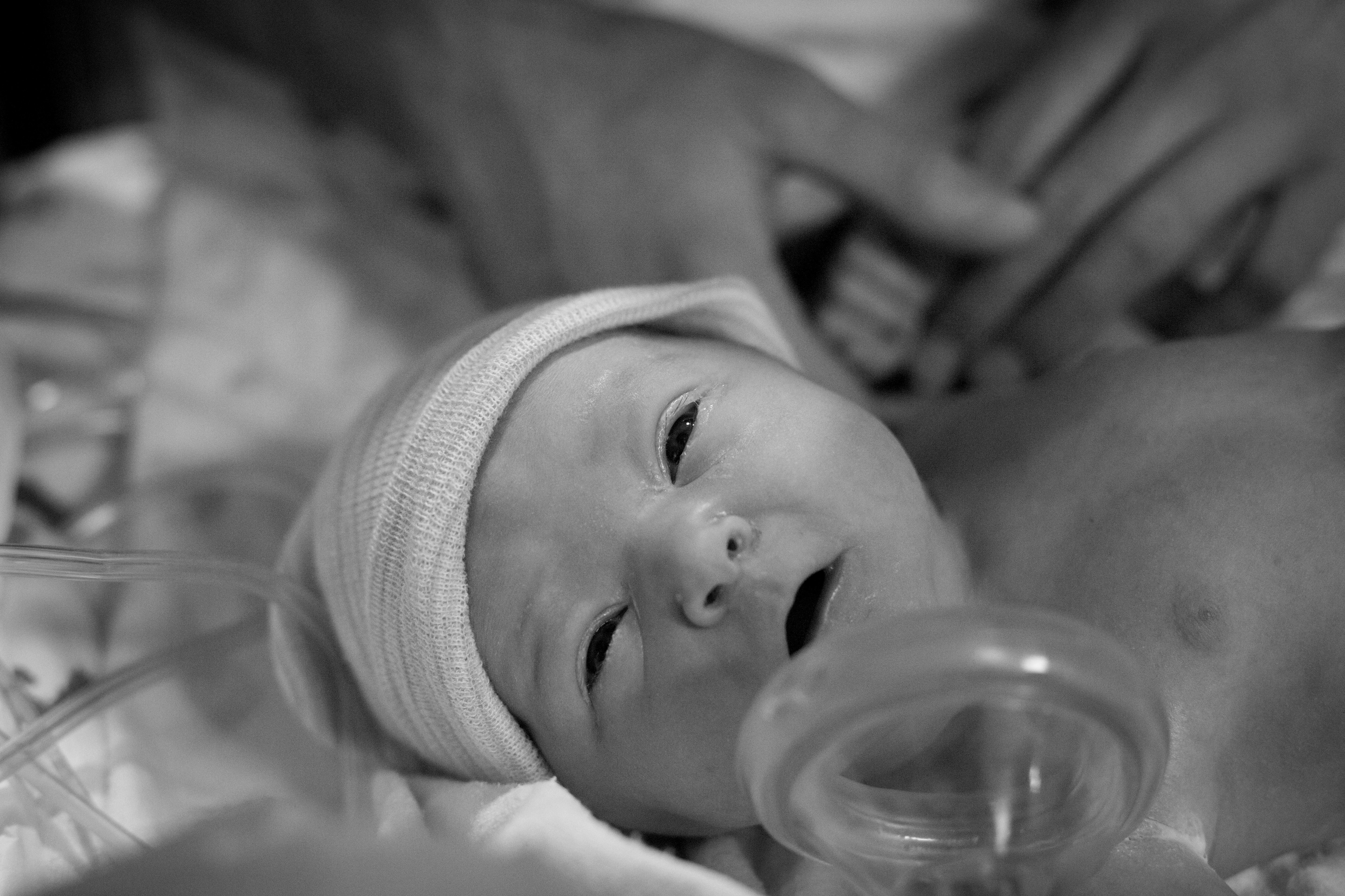 Brand new baby girl at her birth by Pueblo birth photographer