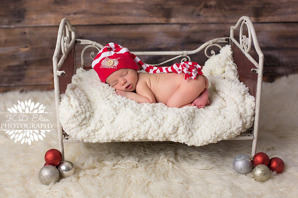 Newborn baby boy's Christmas photos from Pueblo newborn photographer K.D. Elise Photography.