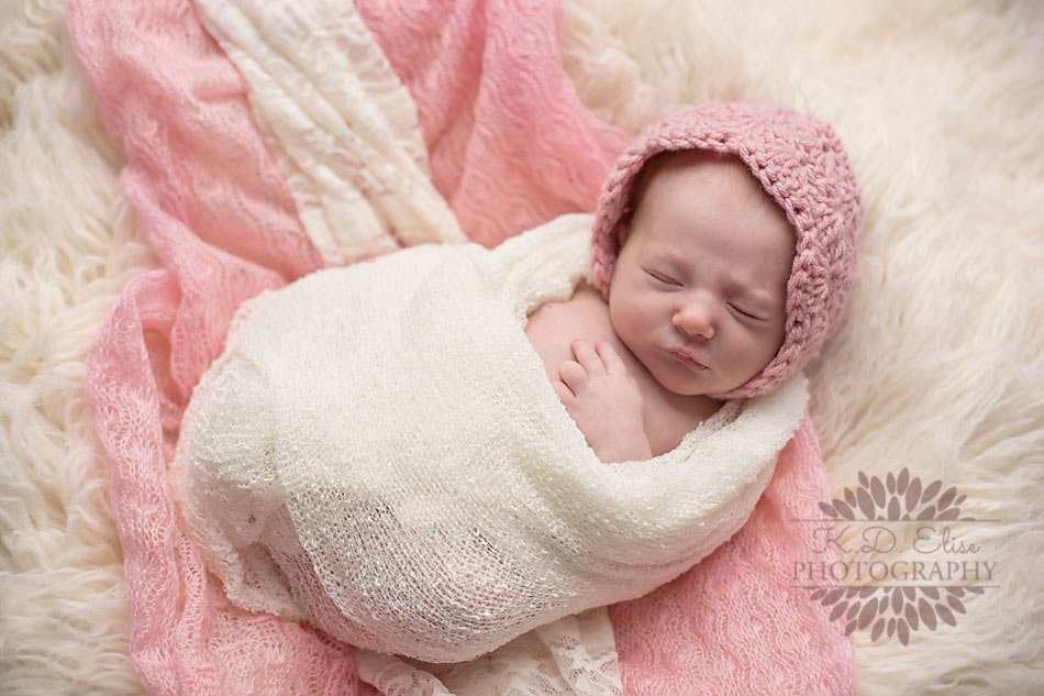 Baby girl in pink and cream by Pueblo Baby photographer.