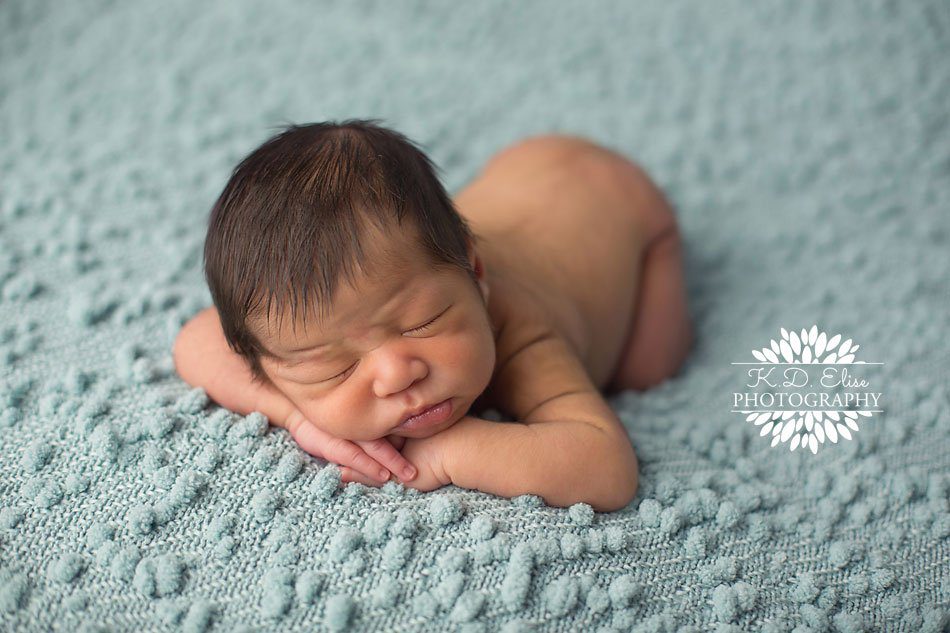 Newborn photography from Colorado Springs Newborn photographer K.D. Elise Photography, baby boy sleeping on his hands. 