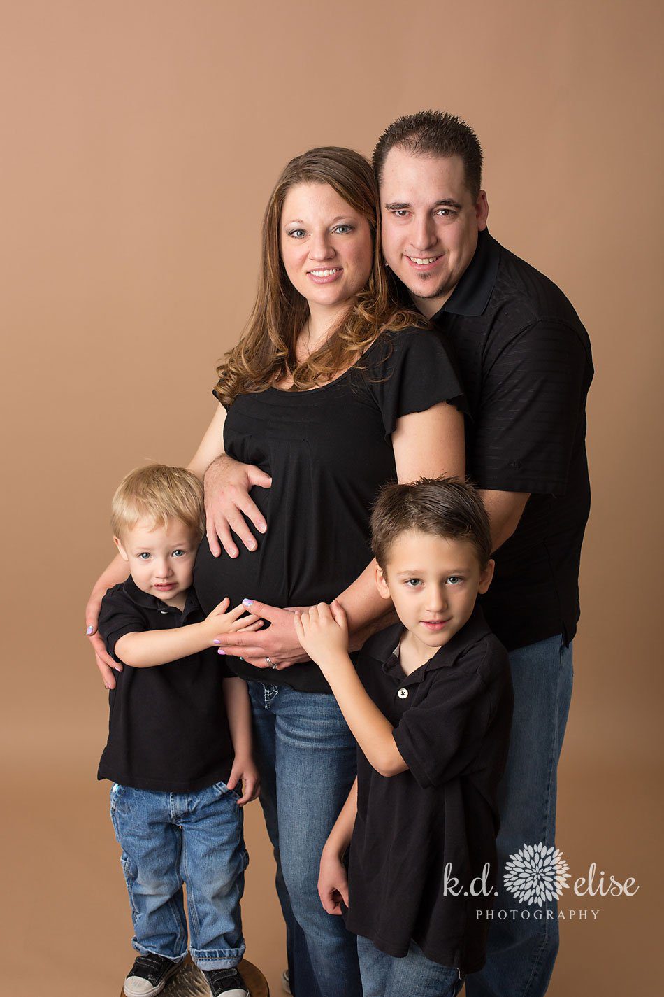 In studio family maternity photography by Pueblo photographer K.D. Elise Photography.