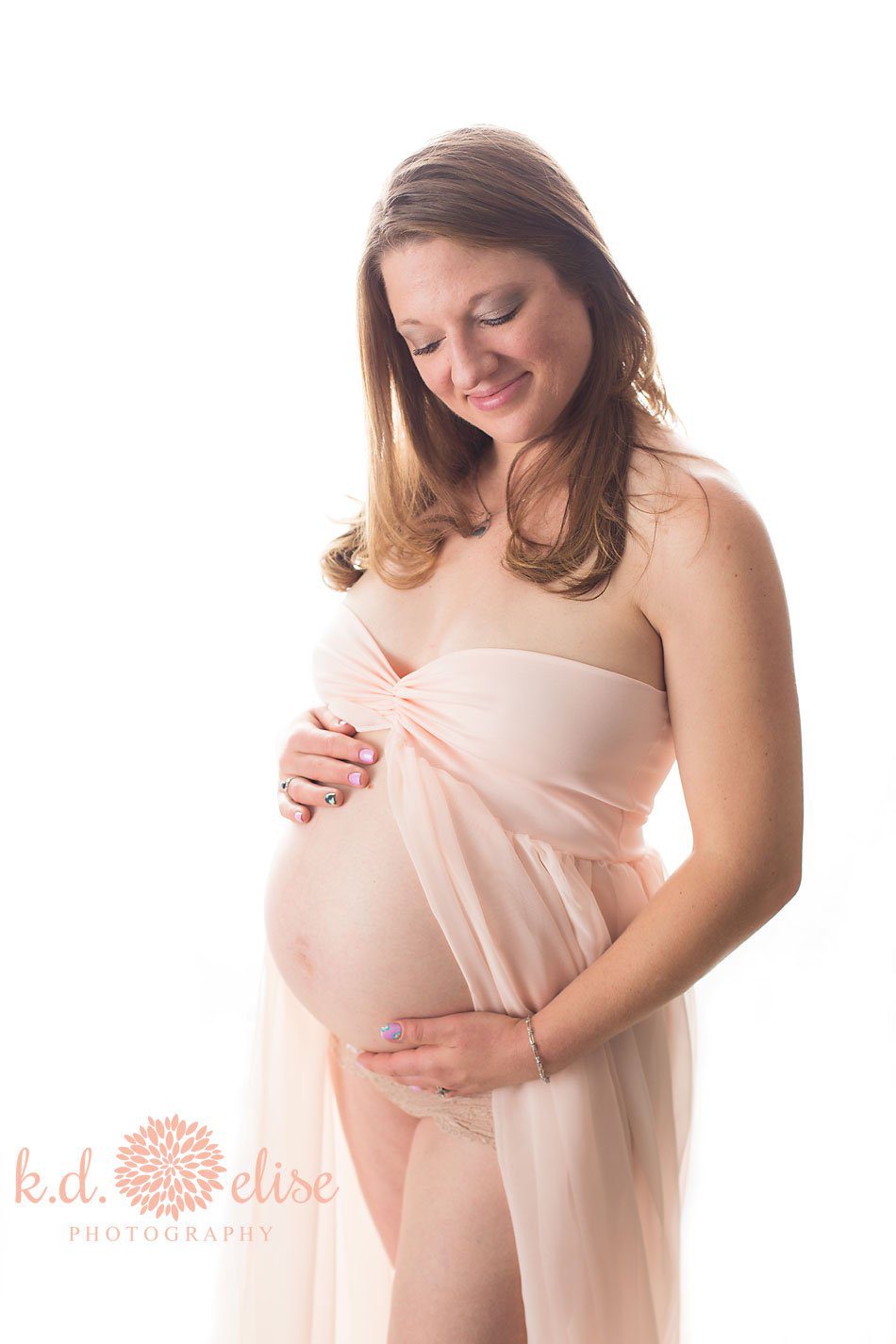 In studio maternity photo of pregnant mom by Pueblo maternity photographer K.D. Elise Photography.