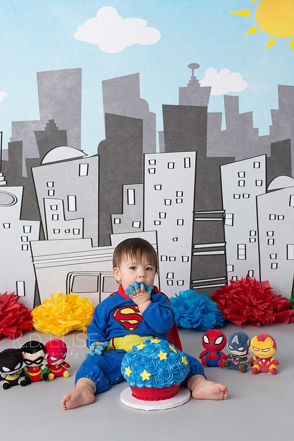 Superhero themed cake smash session by Pueblo photographer K.D. Elise Photography.