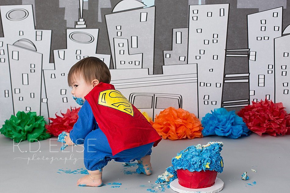 Superhero themed cake smash session by Pueblo photographer K.D. Elise Photography.