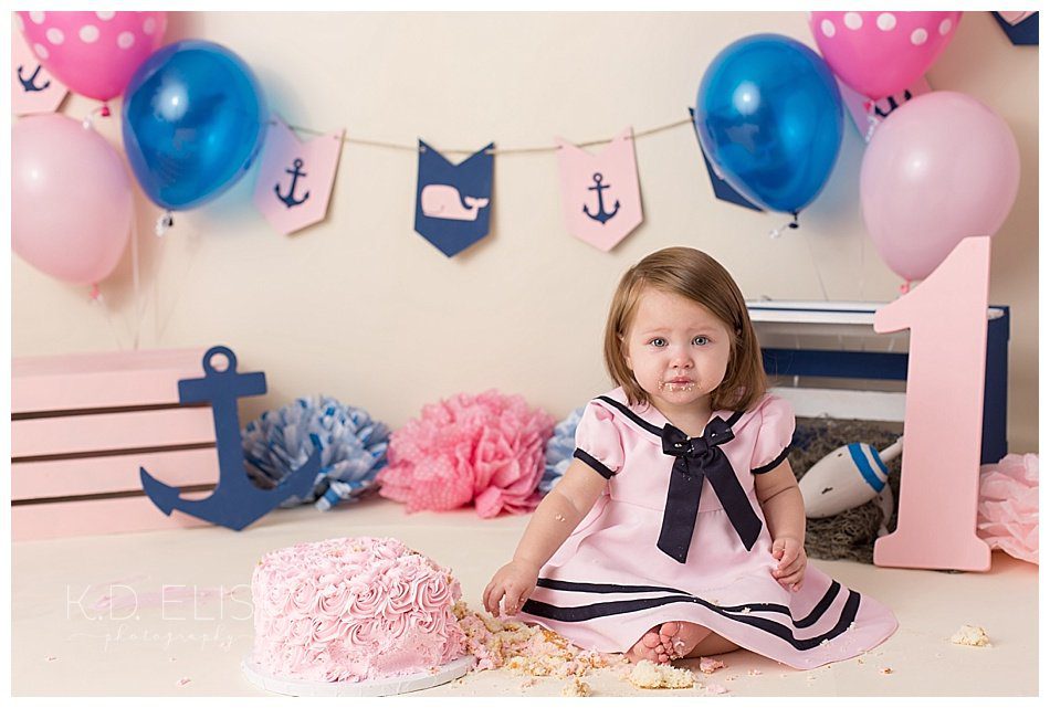 Nautical themed cake smash session for one year old baby girl by Pueblo photographer K.D. Elise Photography.