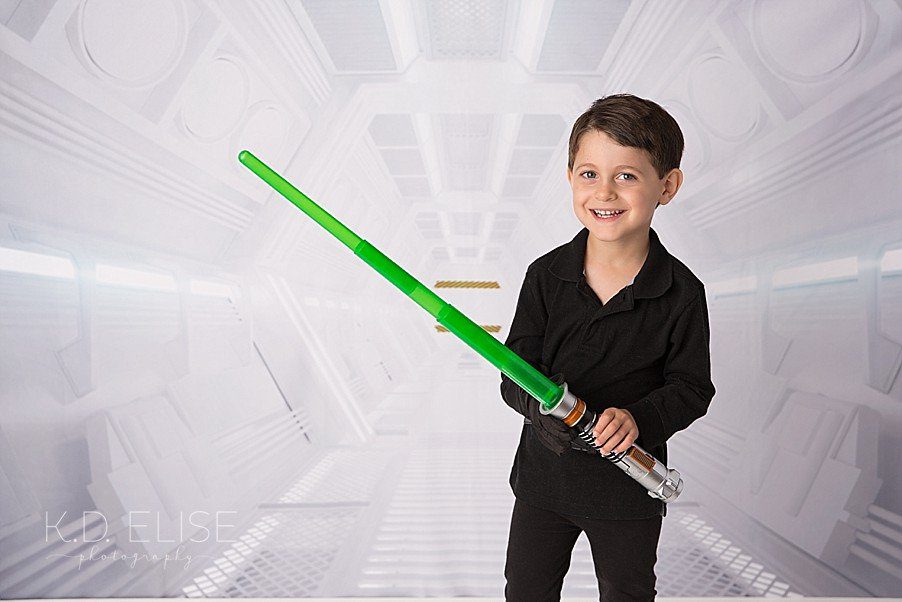 Four year old boy in a Star Wars themed photo shoot.